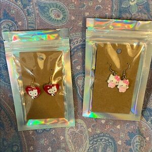 Two pairs of hello Kitty earrings